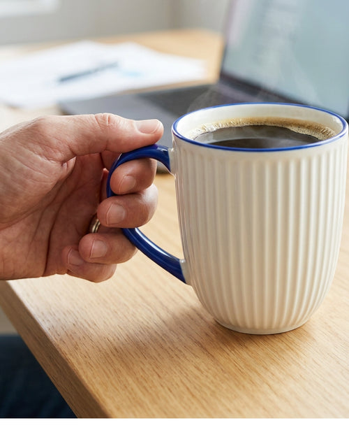 Covae Ribbed Porcelain Mug 420 ml Ivory and Cobalt - Lifestyle view